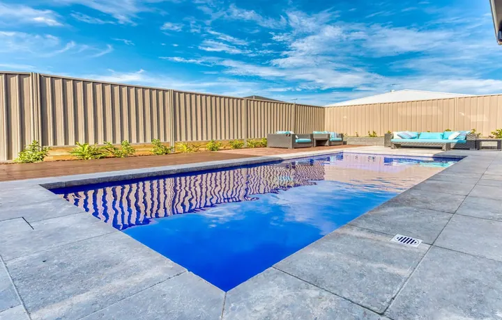 Avanti Masterbuilt pool in a paved backyard
